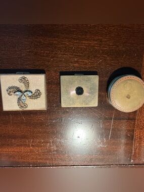 Trio of vintage compacts. They have decades of wear and tear and it shows.